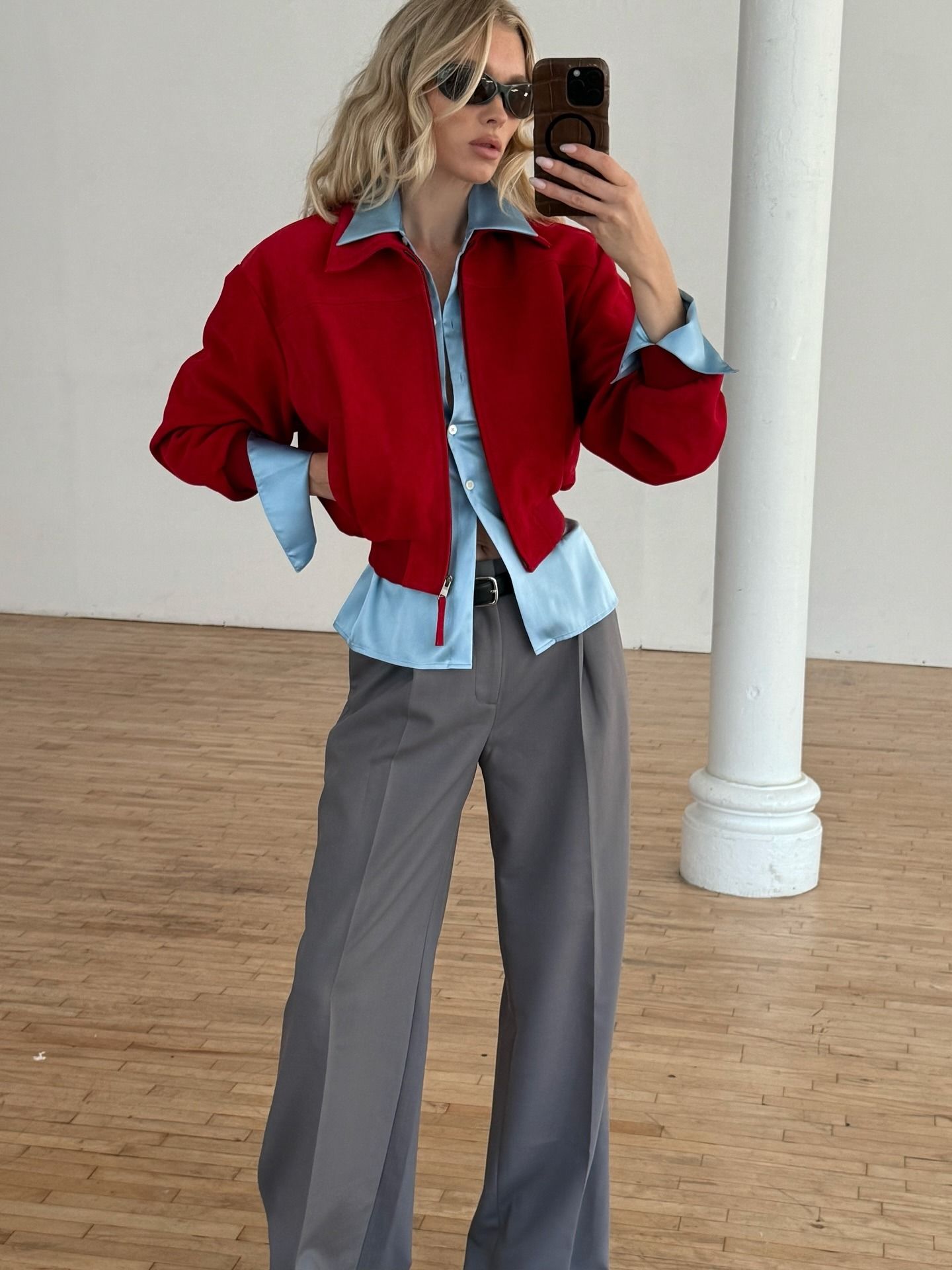 Elsa Hosk takes a mirror selfie wearing the red and blue colour trend.