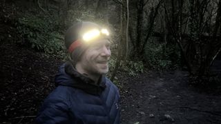 smiling with a headlamp