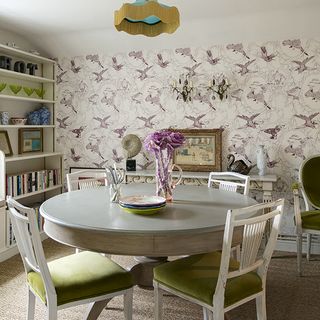 dining room with table and wallpaper
