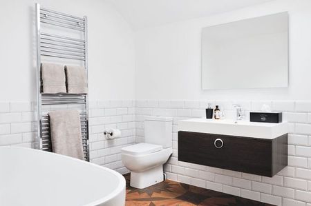 monochrome bathroom with statement flooring