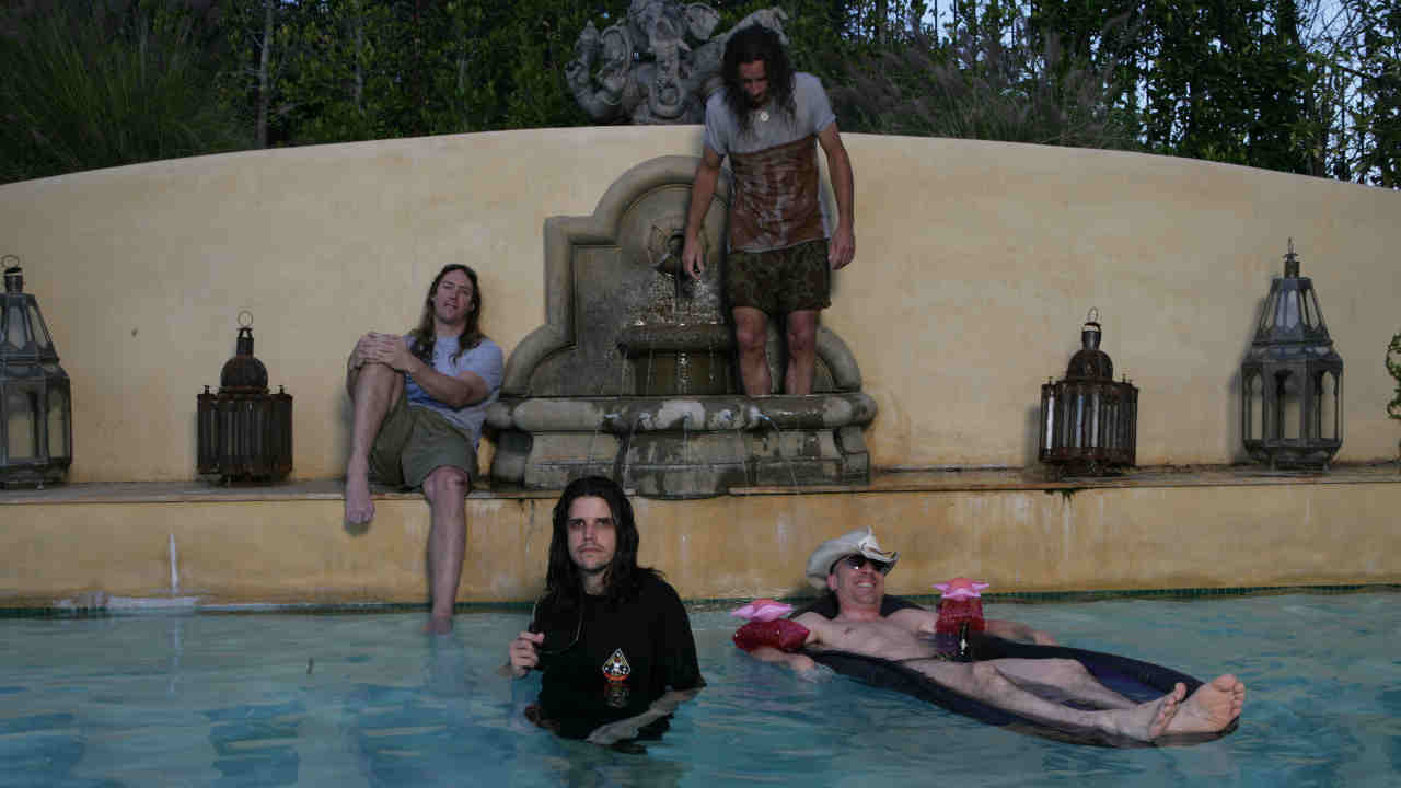 Tool posing for a photograph in a swimming pool