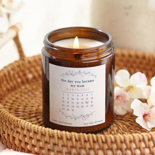 candle with glass jar white flower wooden basket