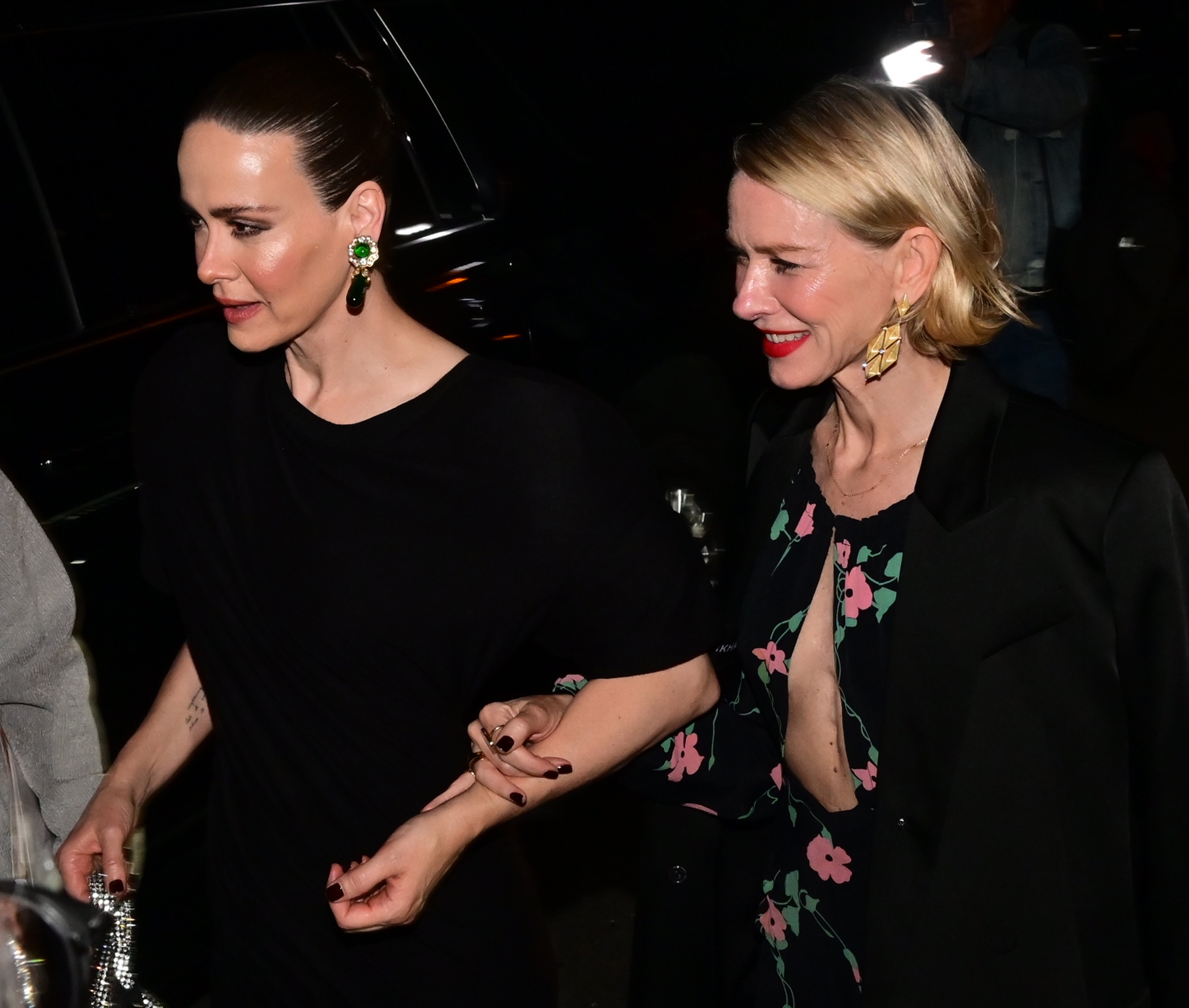 Naomi Watts and Sarah Paulson attending a party together. They both have short, black, square nails