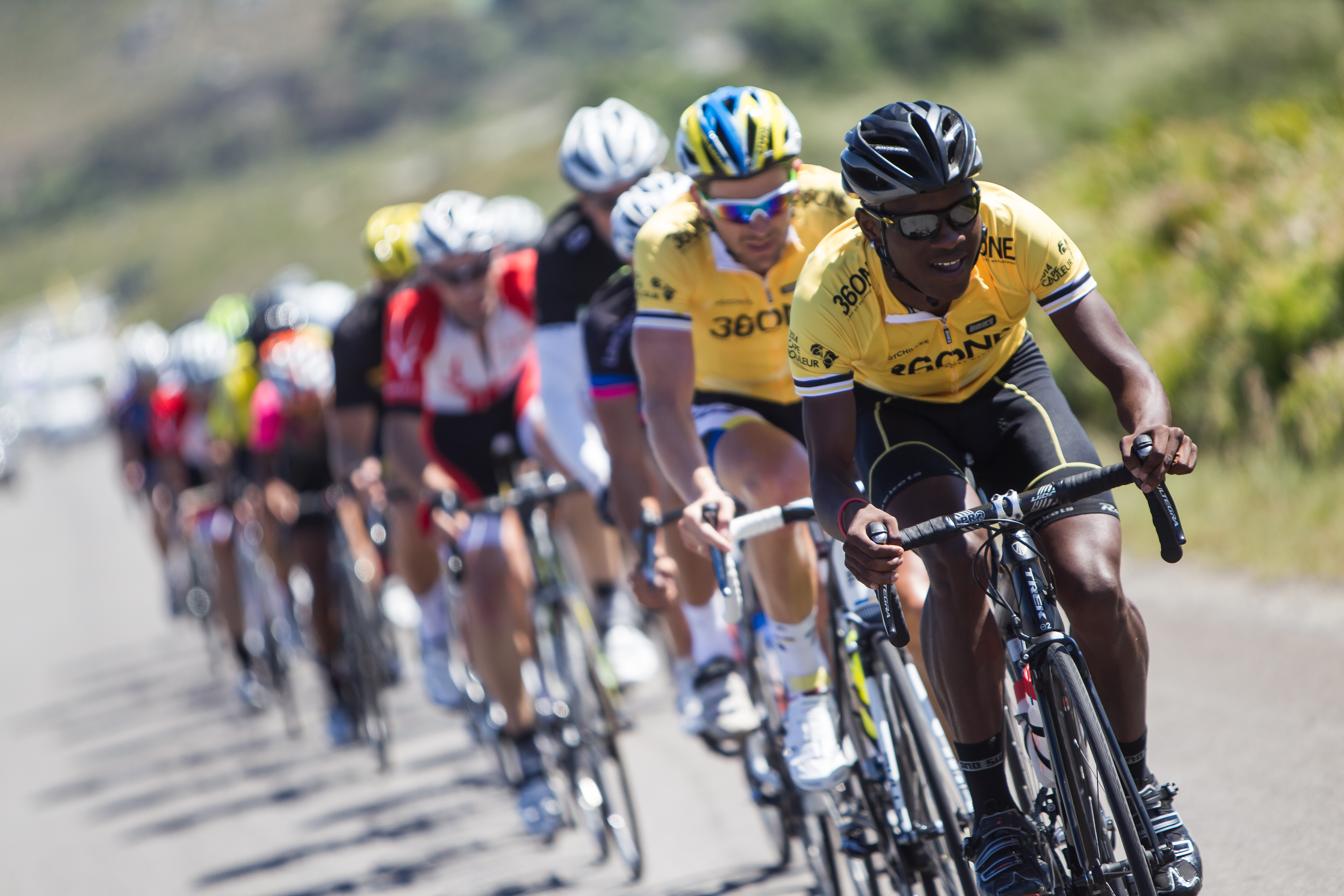 Nicholas Dlamini in the 360NE amateur leader's jersey with Team Bulls rider Karl Platt on his wheel, Cape Rouleur 2013