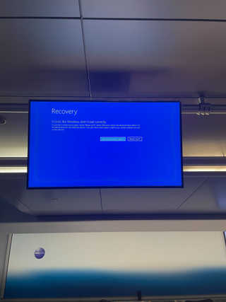 Windows errors appear on travel boards at JFK airport amid ongoing service disruptions to business and services.