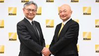The new Nikon CEO Yasuhiro Ohmura (on the right) shaking hands with Muneaki Tokunari as Representative Director and Chairman
