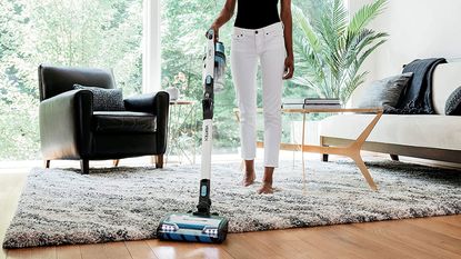 shark vacuum cleaner being used in living room