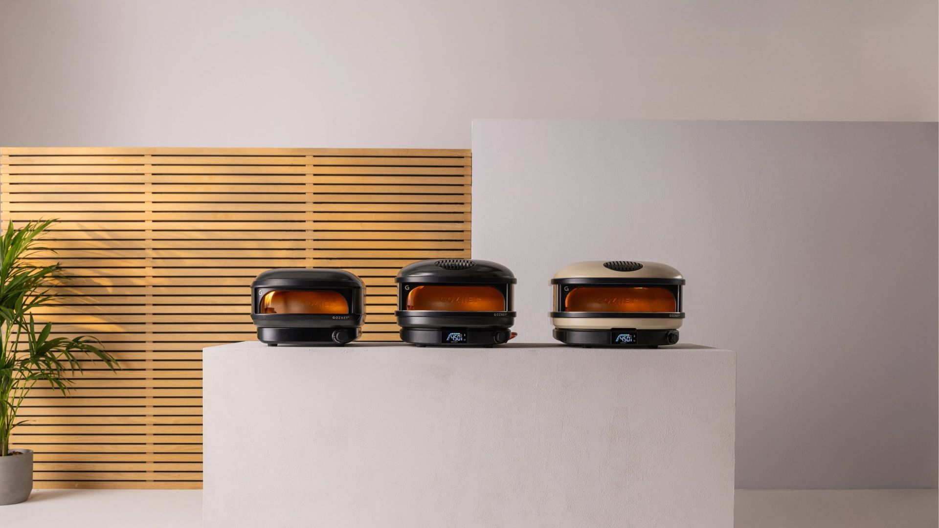 The Gozney Arc Lite Pizza Oven next to the Gozney Arc and the Gozney Dome