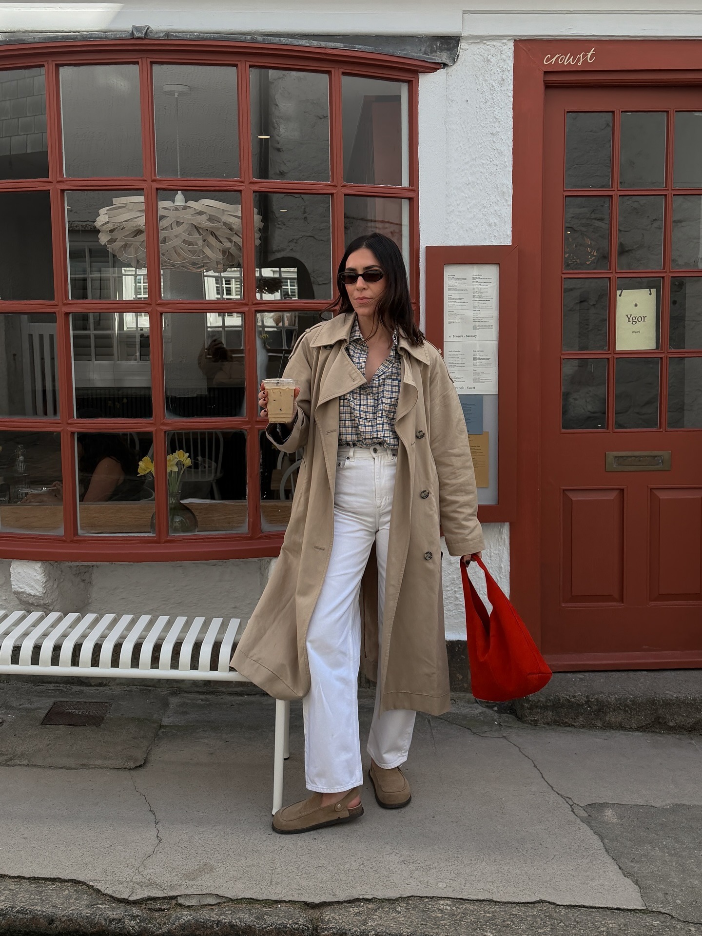 Woman wearing colorful handbag, a 2026 trend.