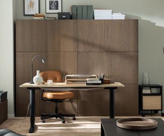 wooden office storage with desk in front and office chair