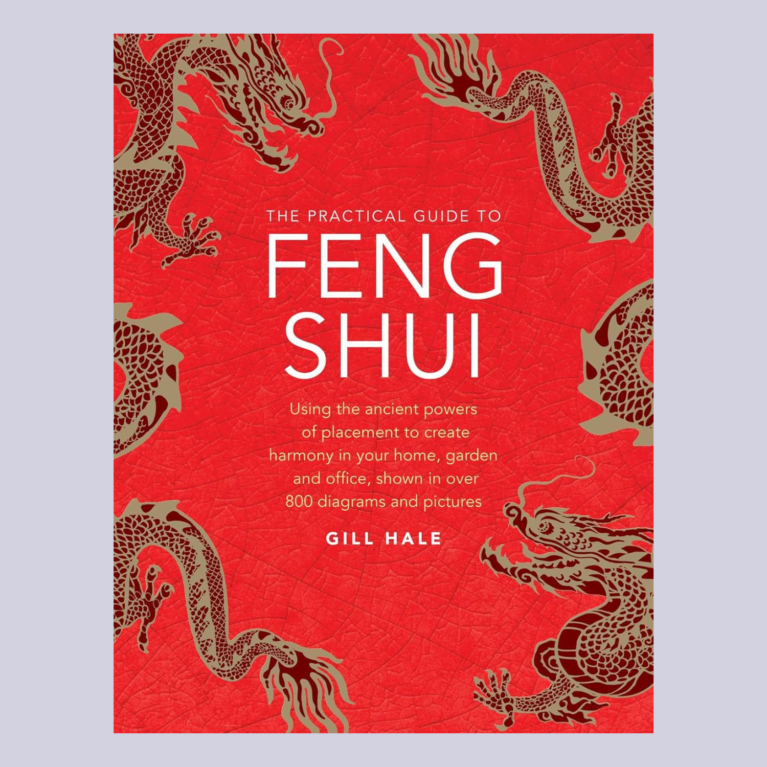 A red hardcover book titled' The Practical Guide to Feng Shui'