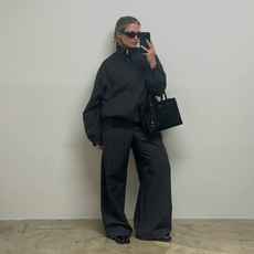 Influencer Alexis Foreman wearing a funnel-neck jacket and wide-leg trousers. 