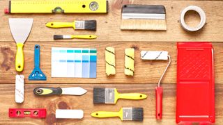 Selection of DIY tools on wooden background
