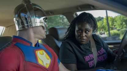 John Cena and Danielle Brooks sitting in a car in Peacemaker season 2