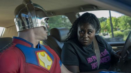 John Cena and Danielle Brooks sitting in a car in Peacemaker season 2