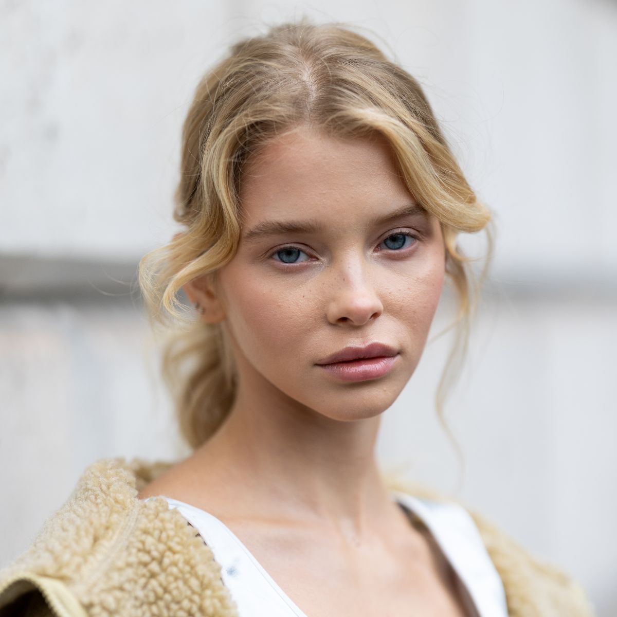 woman with blonde hair and perfectly clear skin