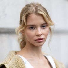 woman with blonde hair and perfectly clear skin