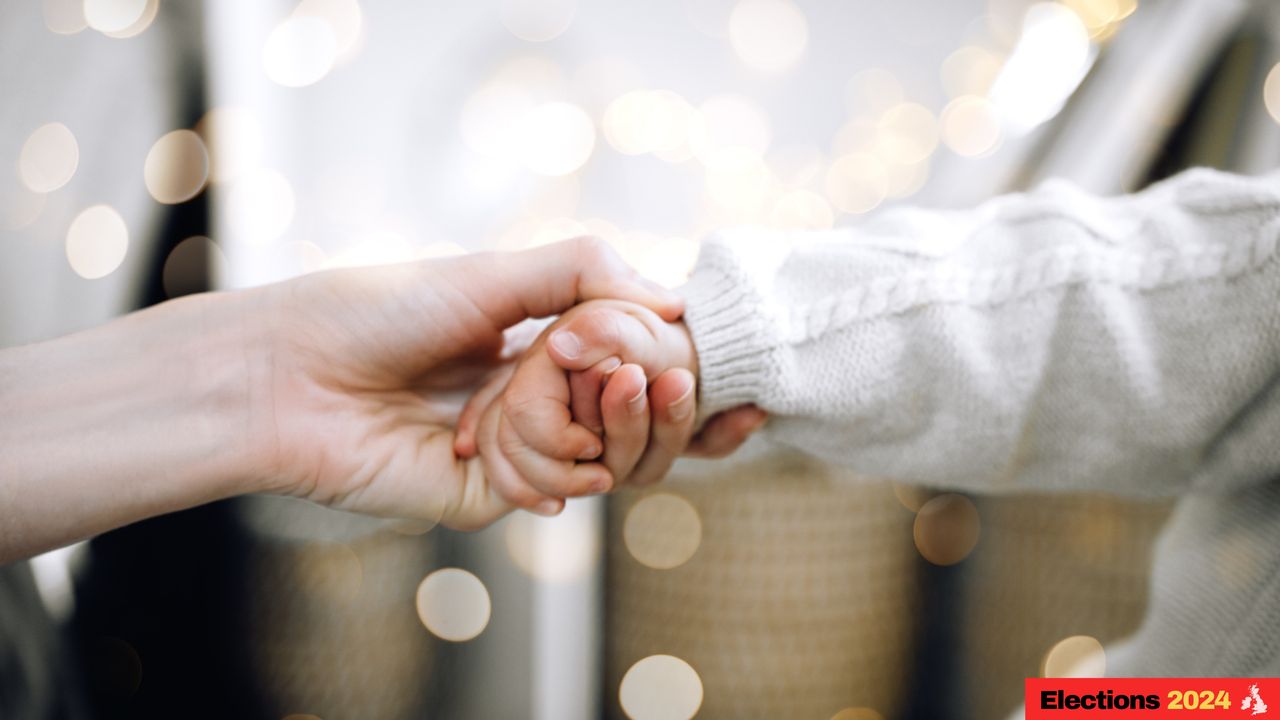 Child holding parent&#039;s hand