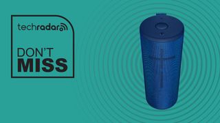 Ultimate Ears Megaboom 3 speaker against cyan background with words &#039;TechRadar - don&#039;t miss&#039; positioned to the left of the product