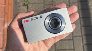 The Lola digital camera in the palm of a hand