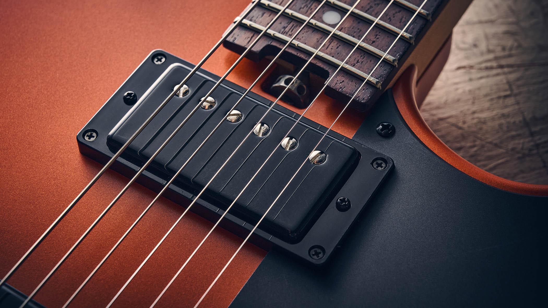 Manson MD-3 Mikey Demus Signature: the hot-orange T-style is photographed against a distressed grey-white background