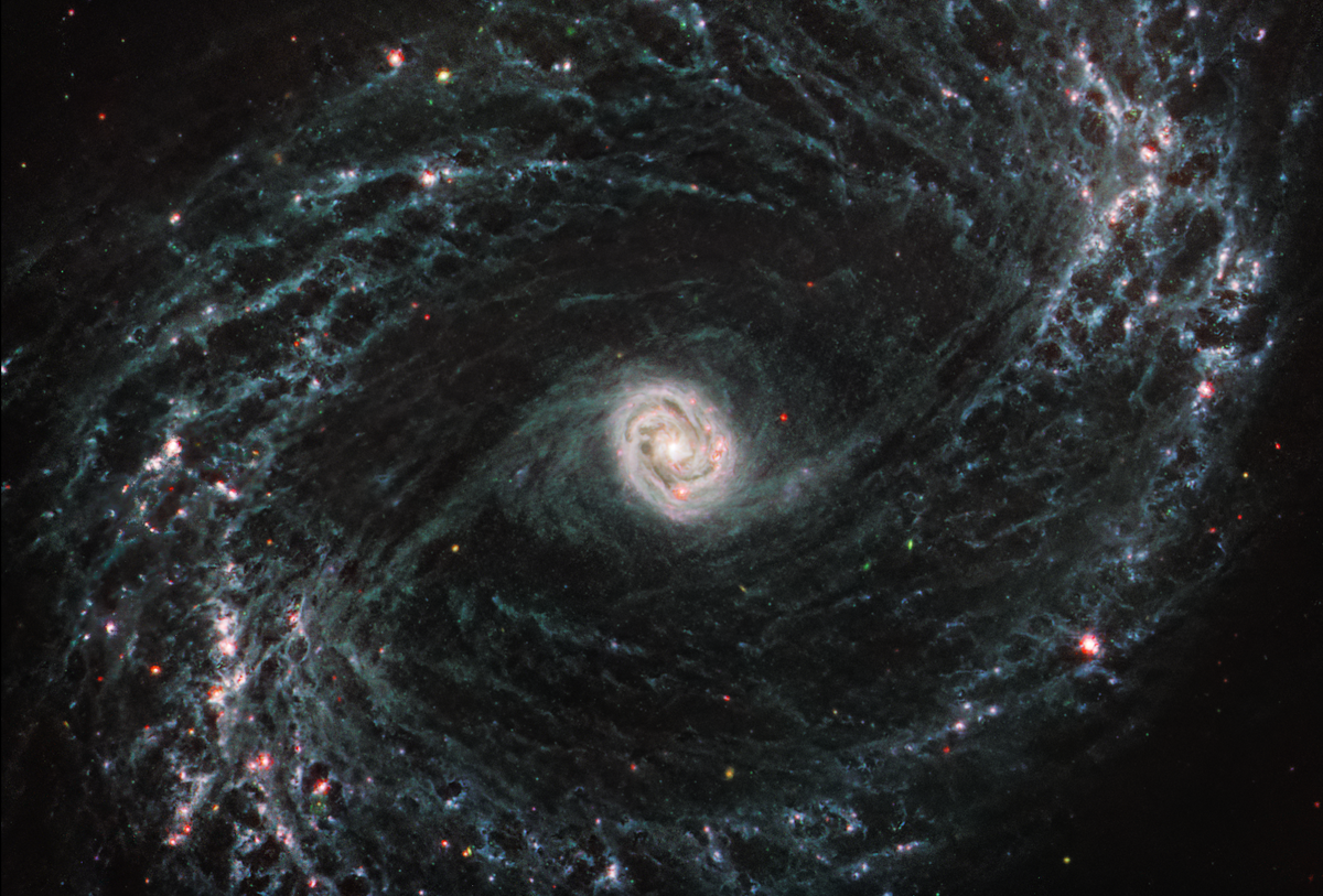 At the center of a galaxy, a tight, bright core featuring a unique double ring structure shines in exquisite detai