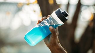 Blue energy drink in reusable water bottle