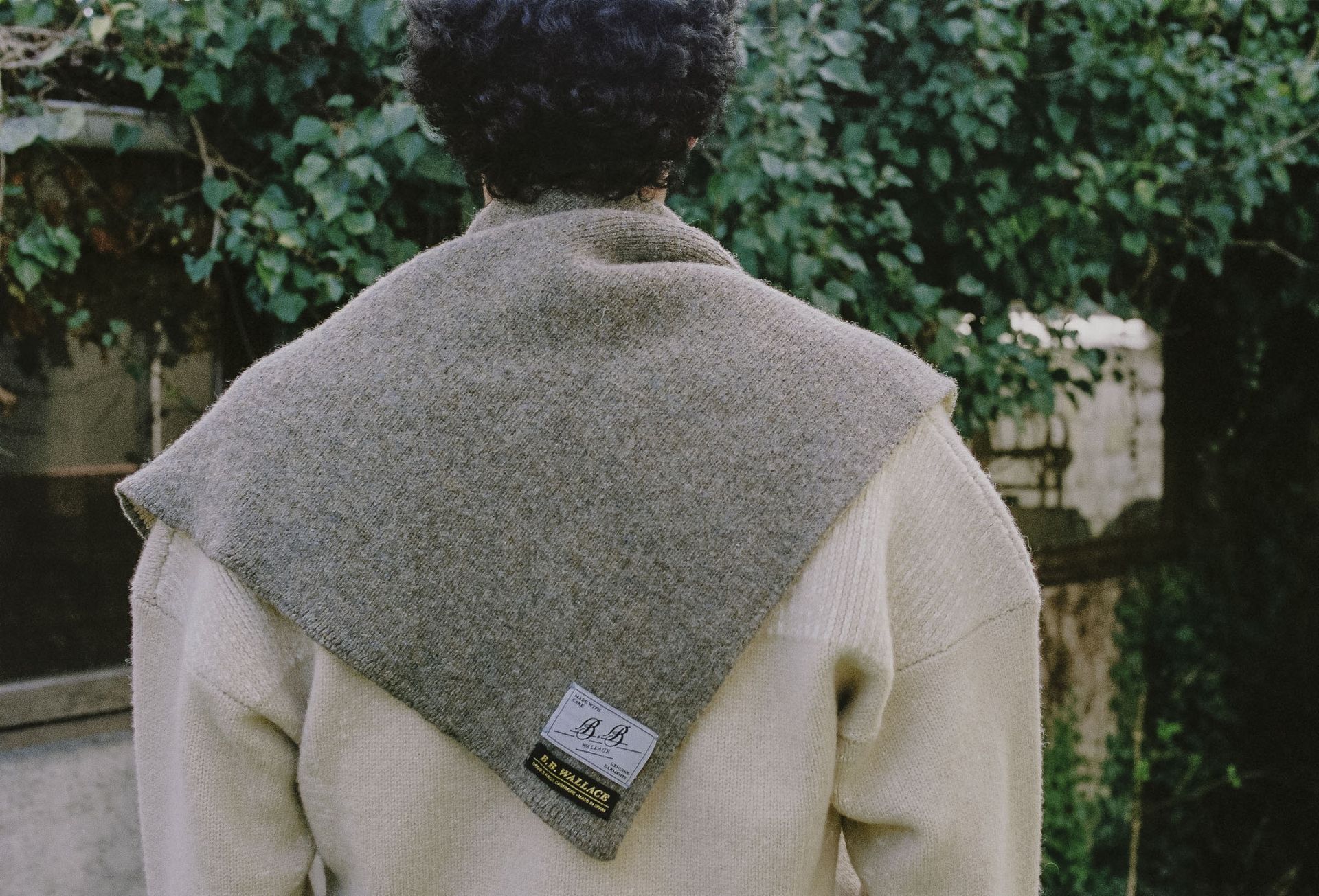 model from behind, wearing wool scarf