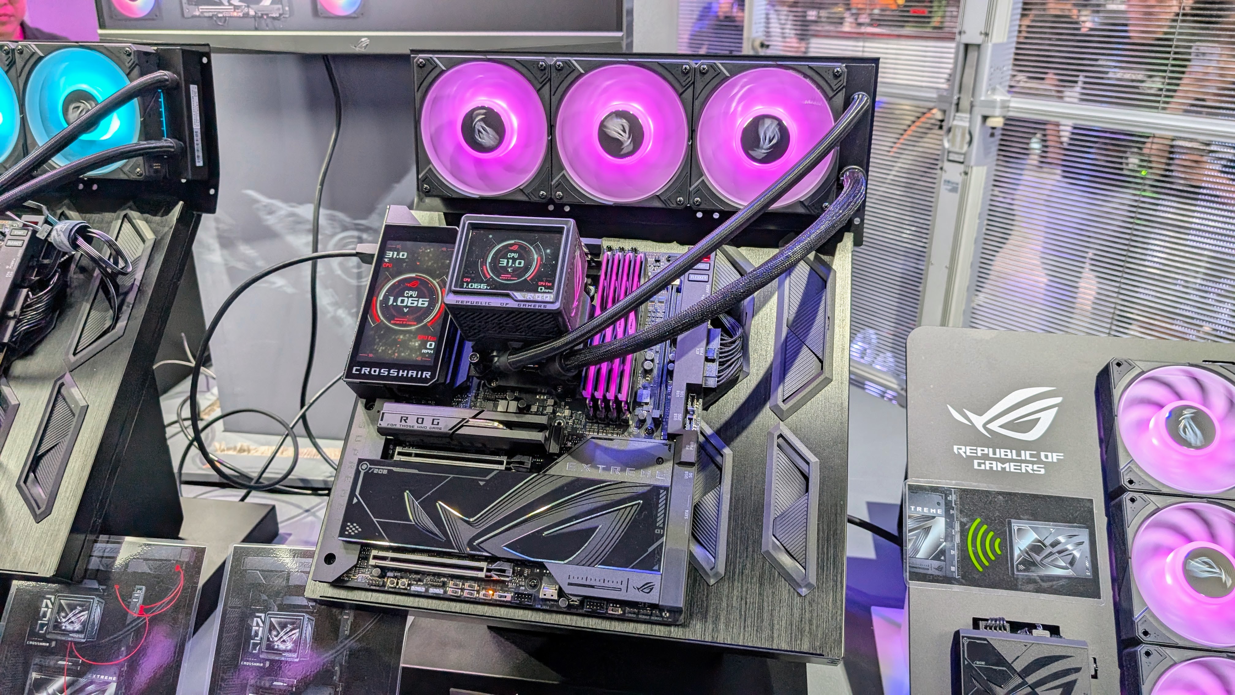 Asus ROG Crosshair X870E Hero motherboard with LCD AIO cooler at Computex 2025