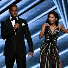 Ludacris and Vanessa Hudgens on stage together.