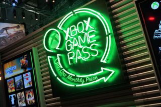 Green neon sign of the Xbox Game Pass logo