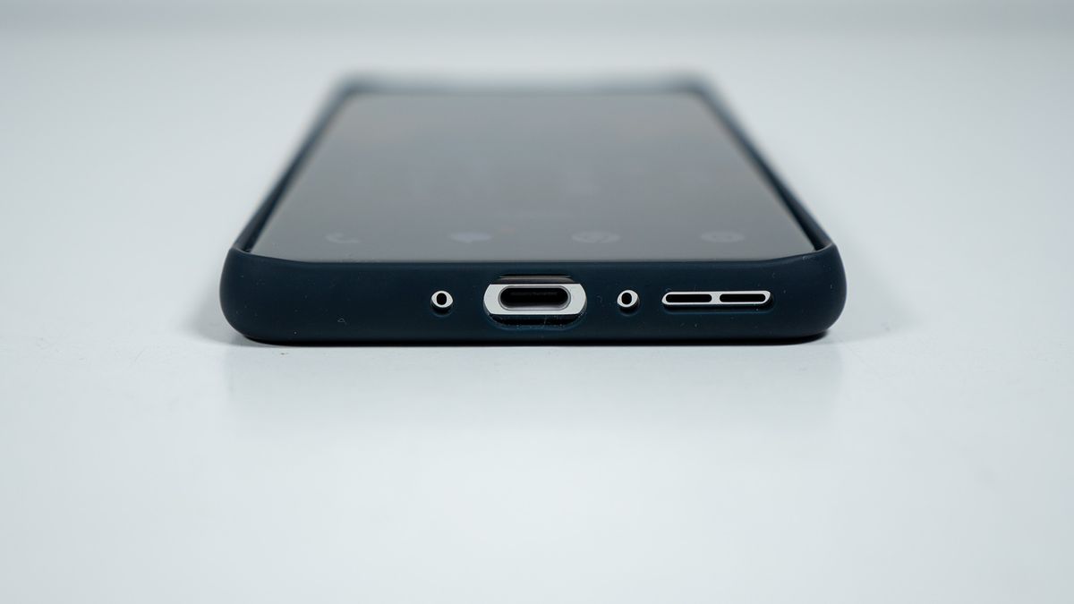 The bottom of the official blue OnePlus 13 soft case