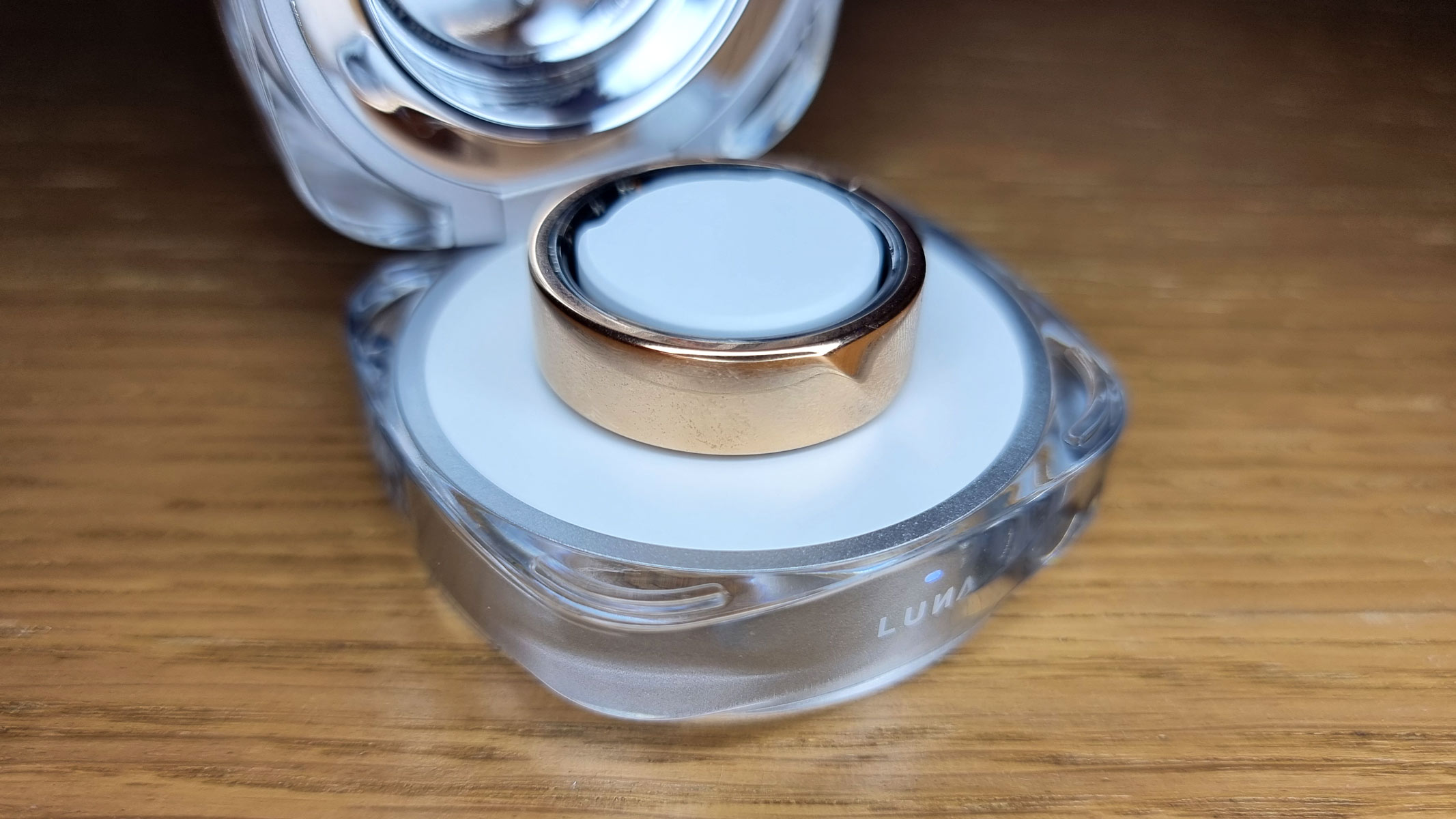 A close-up picture of the Luna Ring Gen 2 placed in an open charging case