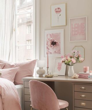 Pretty pink bedroom office with coordinated blush theme gallery wall idea.