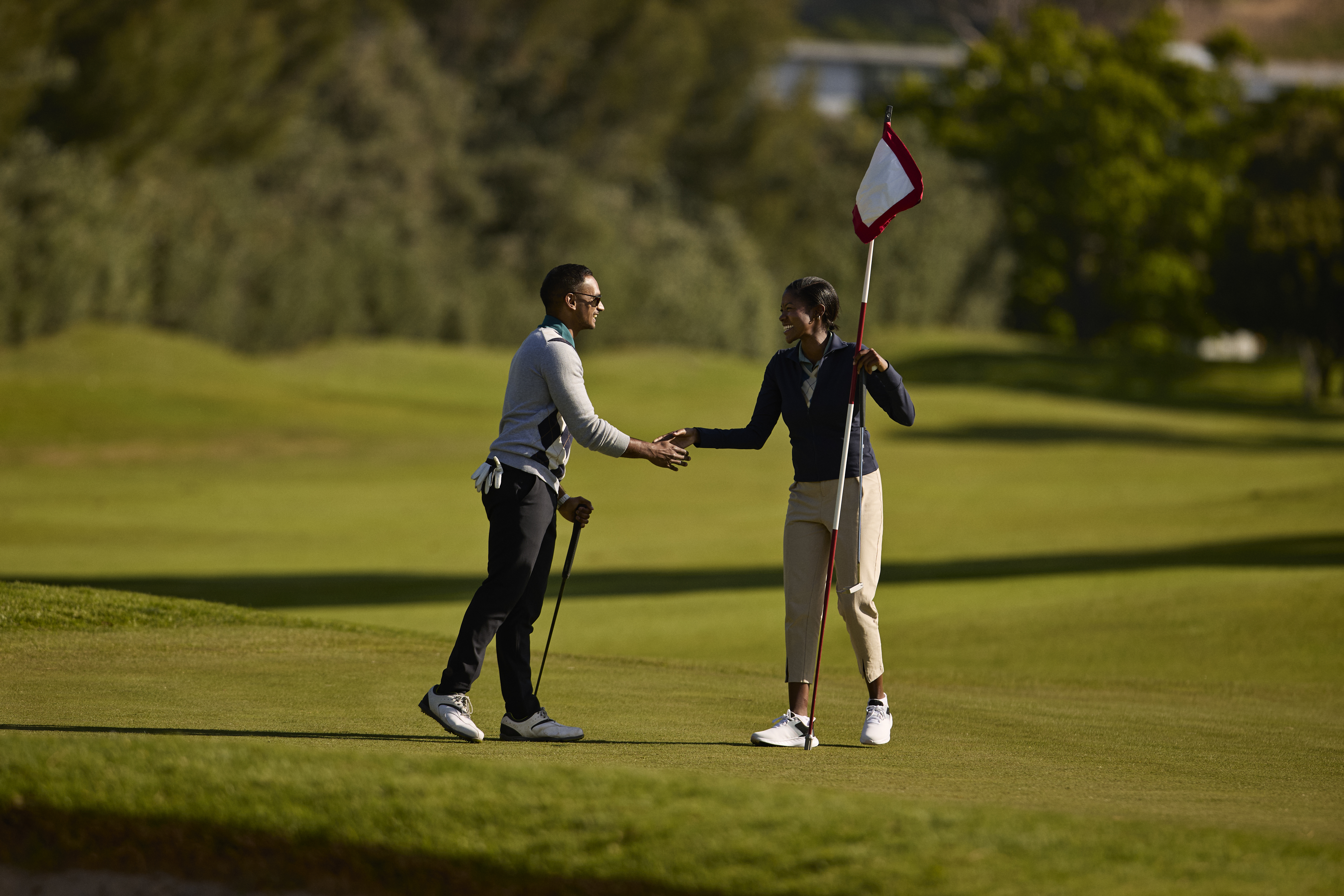 Golfers shaking hands at the end of a round