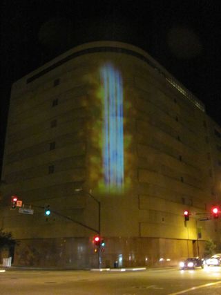 Particle Falls is a large-scale projection that allows viewers to see current levels of fine particles in the air by cascading data down the façade of the AT&T building in San Jose, Calif.