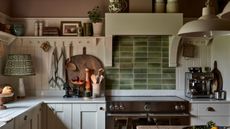 A country cottage kitchen with a green tile backsplash