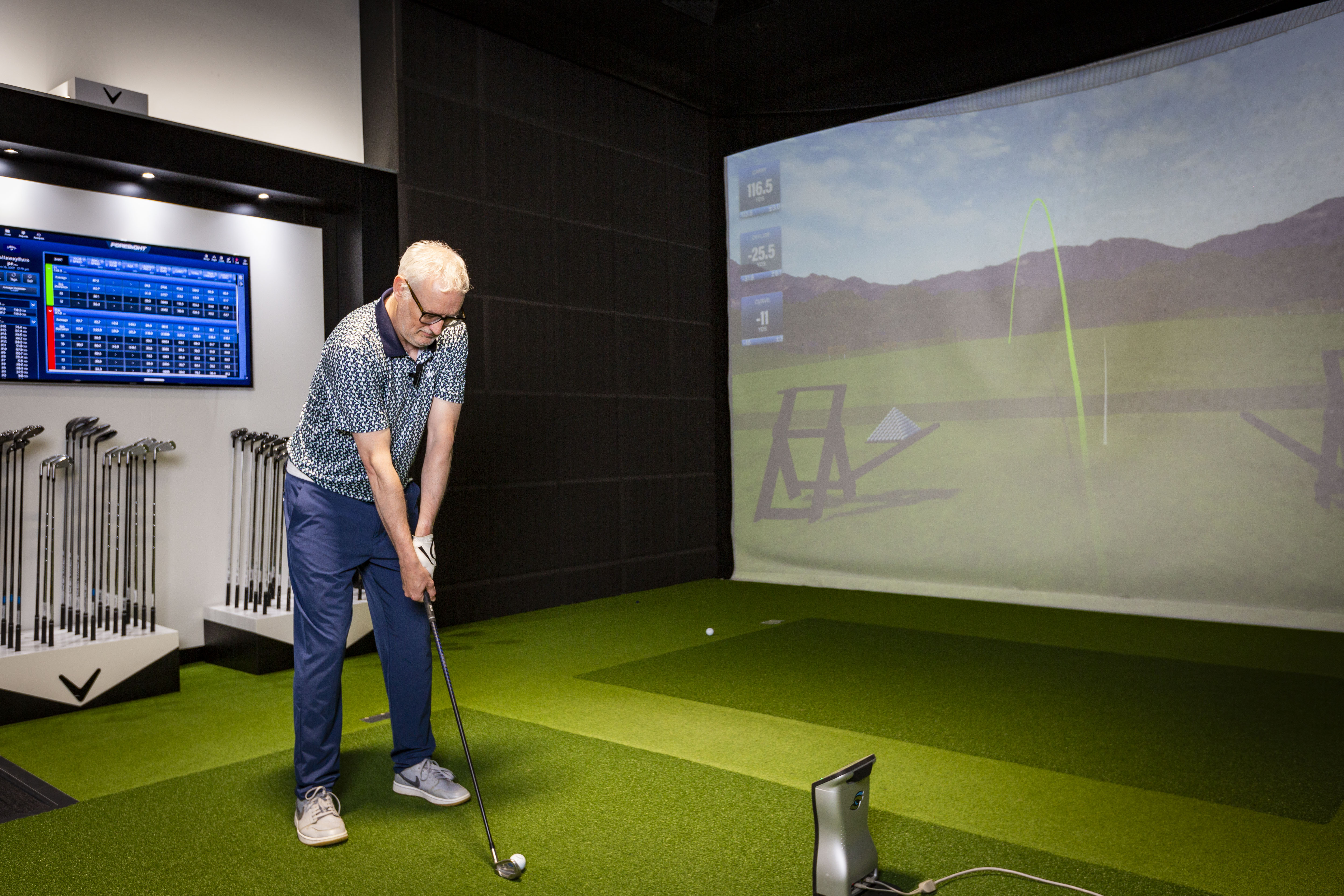 Rob Spedding addresses the ball on the simulator at Callaway's European Performance Center
