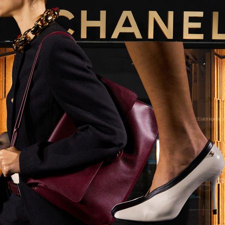 women wearing New Chanel on the runway and outside the Paris store