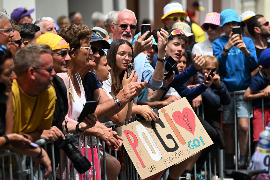 SAINTJEANDEMAURIENNE FRANCE JULY 03 Fans of Tadej Pogacar of Slovenia and UAE Team Emirates Yellow Leader Jersey prior to the 111th Tour de France 2024 Stage 5 a 1774km stage from SaintJeandeMaurienne to Saint Vulbas UCIWT on July 03 2024 in SaintJeandeMaurienne France Photo by Tim de WaeleGetty Images