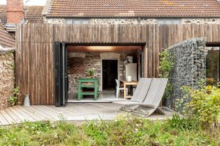timber clad extension to stone house