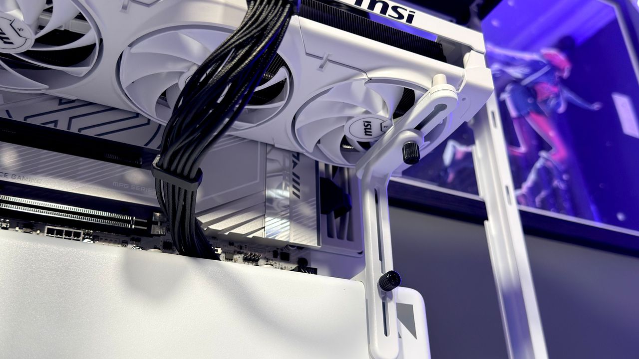 The Havn HS 360 PC case in black and white on a desk.