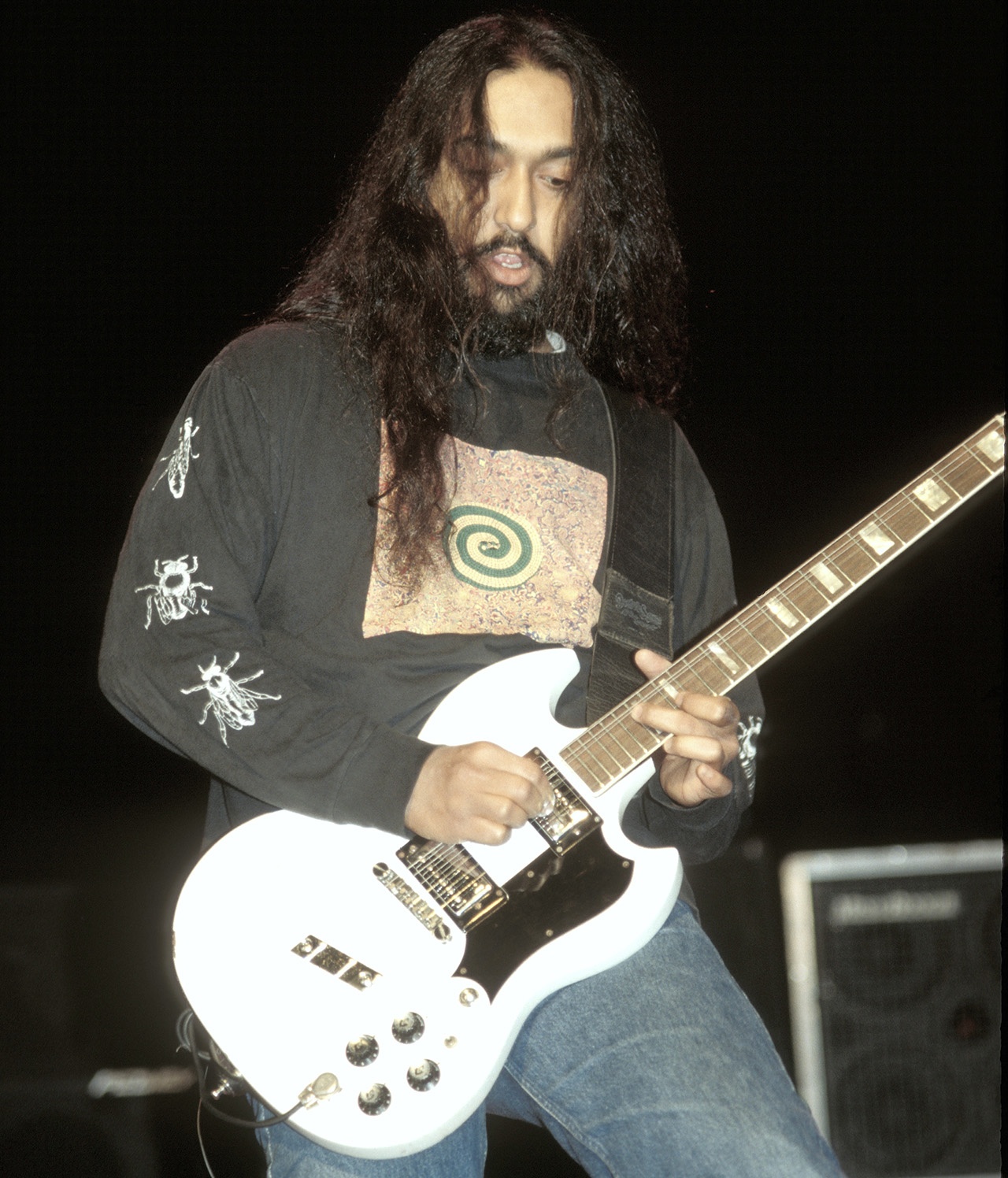 Guitarist Kim Thayil of the rock band Soundgarden is shown performing on stage during a "live" concert appearance on August 23, 1993.