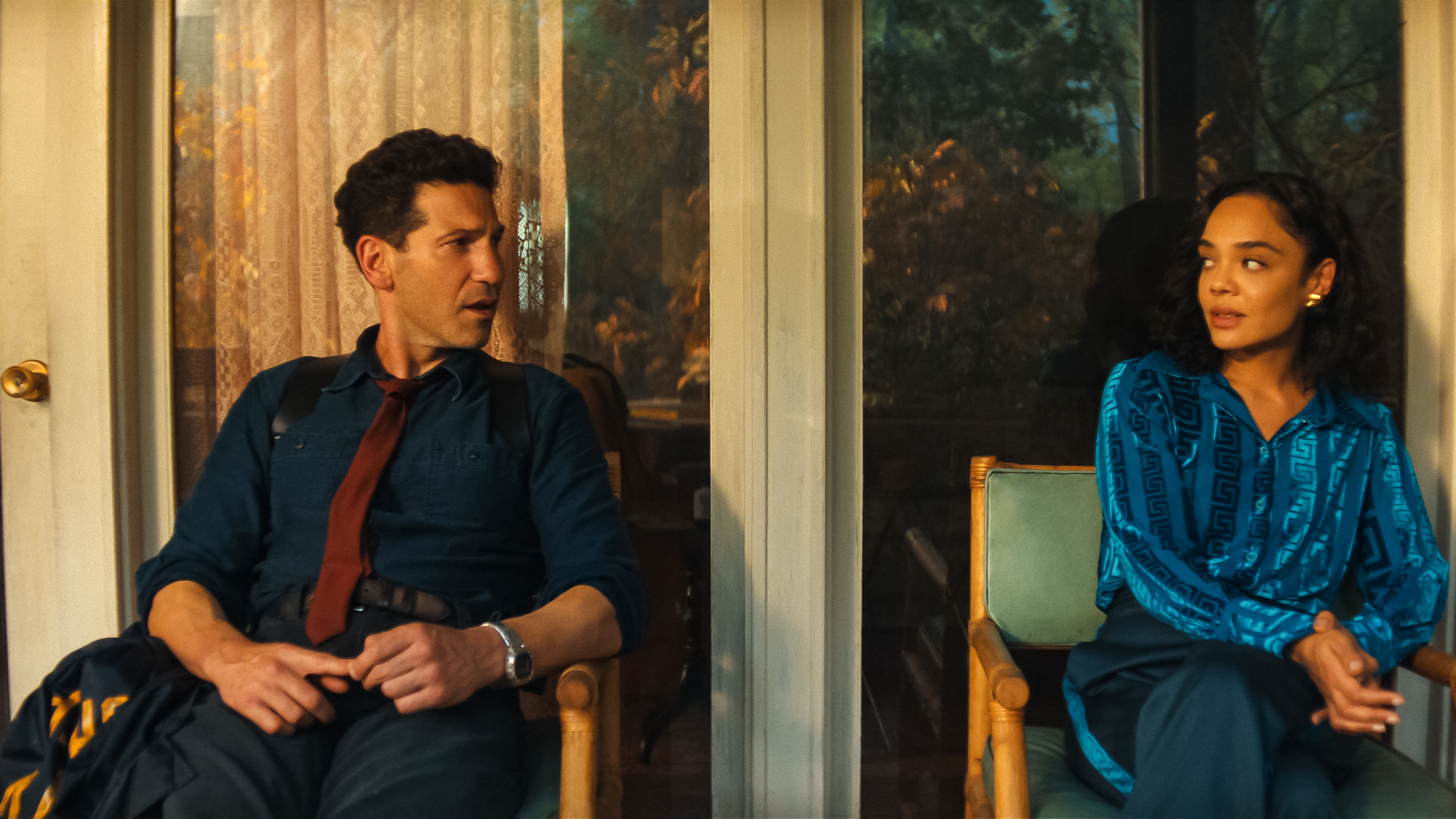 (L to R) Jon Bernthal as Detective Jack Harper and Tessa Thompson as Anna looking at each other.