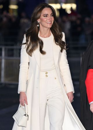 Kate Middleton wearing a cream outfit.