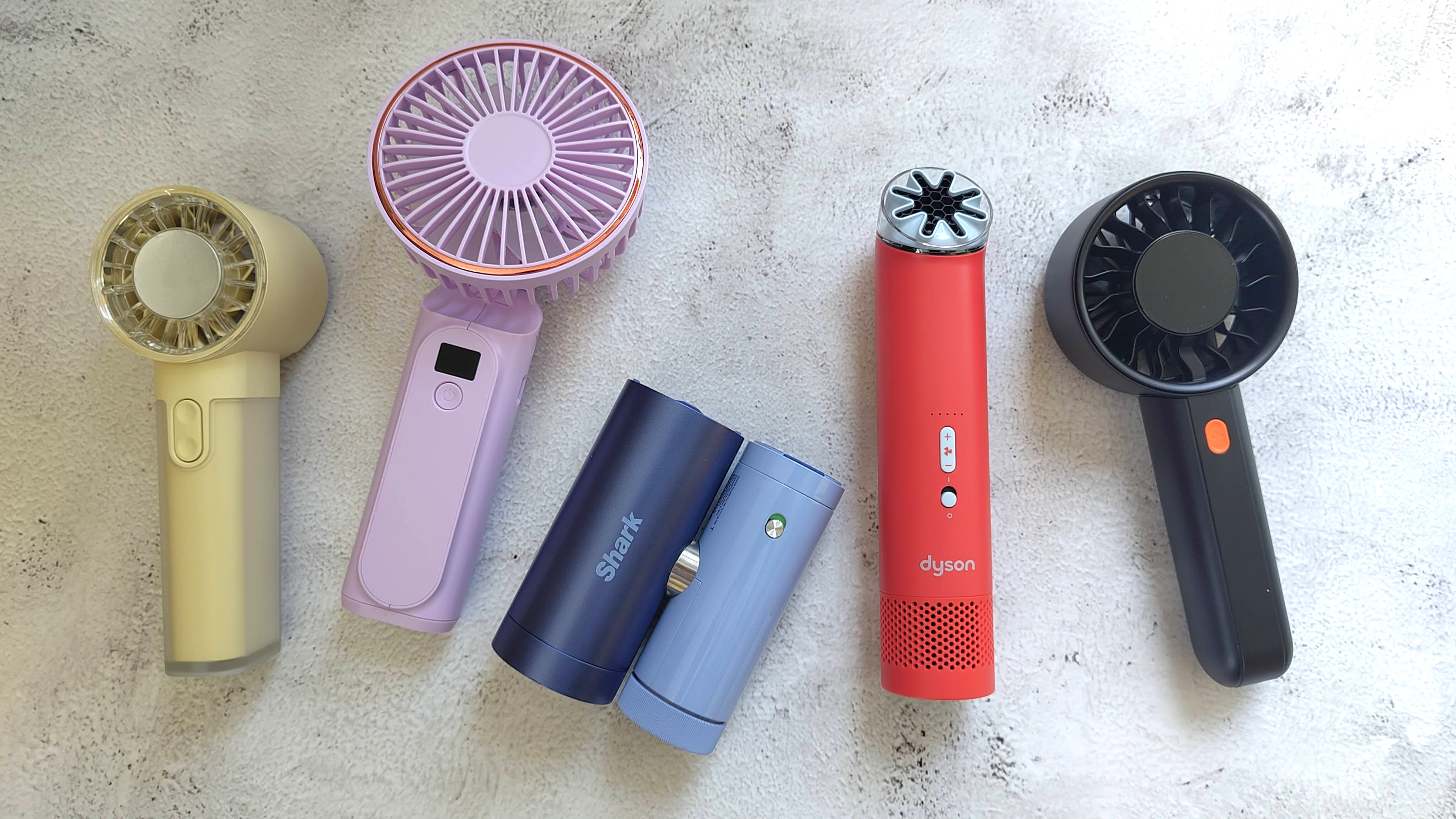 Collection of different handheld electric fans