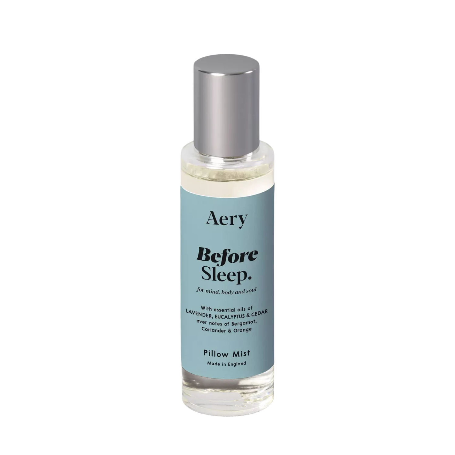A glass bottle of pillow mist with a light blue label and a silver cap