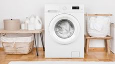 Best washing machine - a washing machine surrounded by laundry products