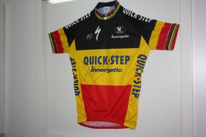A signed jersey from Tom Boonen hangs on the wall