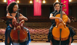 The Perfection playing cellos on stage